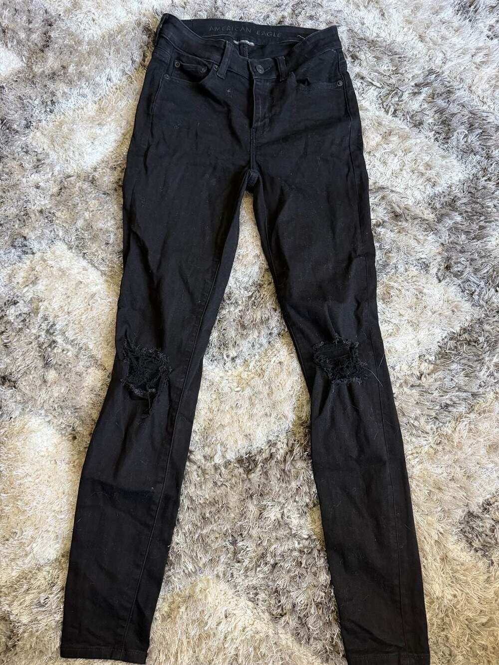 American Eagle Next Level Stretch Jegging Size 2 Regular Black Ripped Jeans